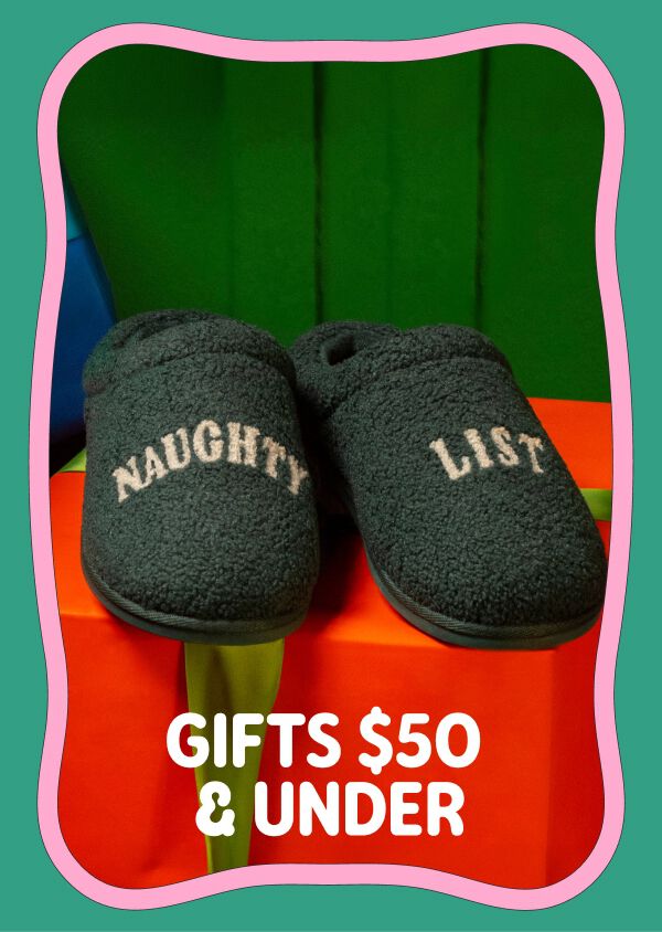 Dark green novelty slippers embroidered &ldquo;Naughty List.&rdquo; Gifts $50 & Under.