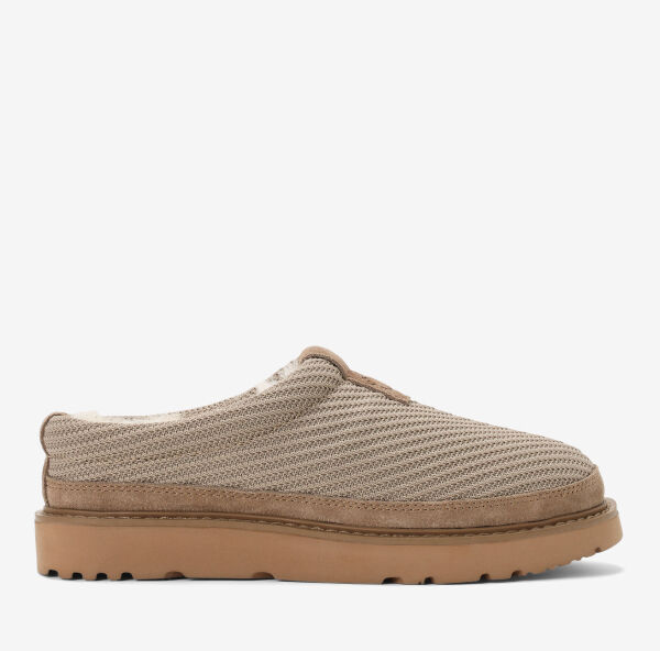 Women's beige water-resistant flex knit clog with a stretchy, breathable upper, genuine 100% Australian shearling lining, memory foam footbed, and durable indoor/outdoor outsole.